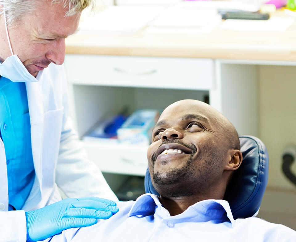 man talking with his dentist