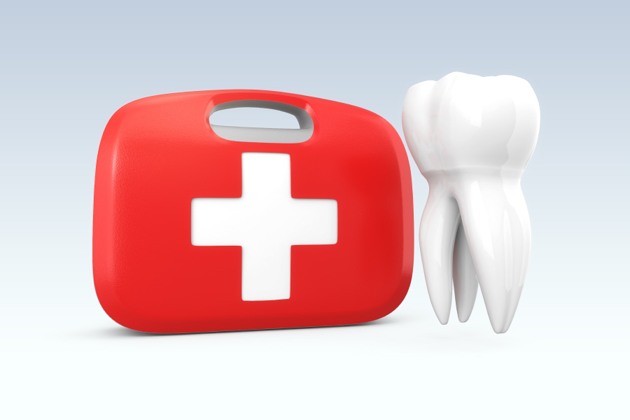 A white tooth floats next to a red and white first aid kit to indicate a dental emergency in Bellevue