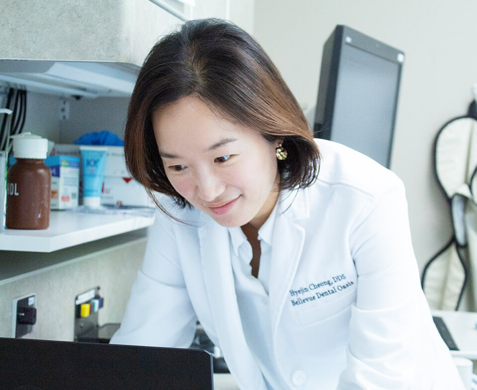 Dr. Cheong looking at a computer