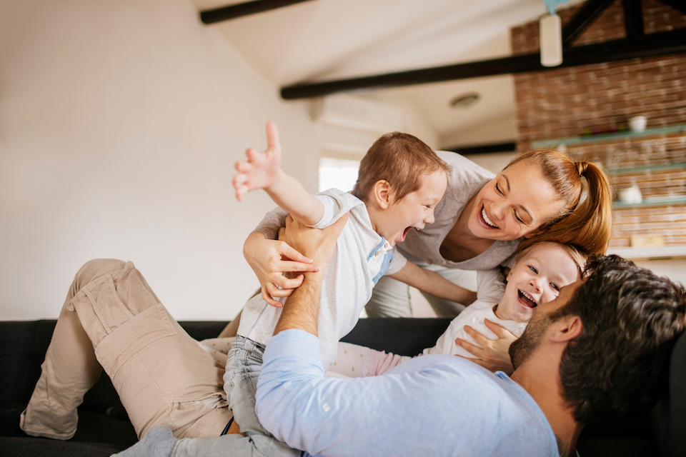 healthy dental habits kids, young family playing together on the couch
