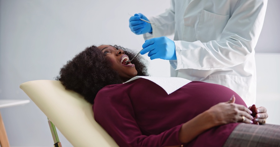 pregnant woman at dentist for oral health during pregnancy